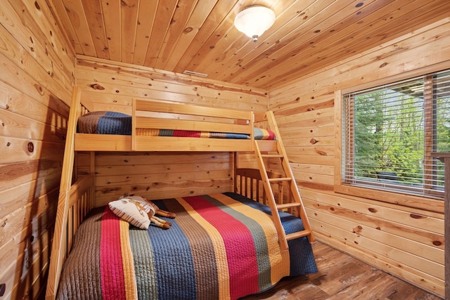 7194 Quentin Rd NE, Outing, MN 56662 - bedroom with a relaxing sauna, wooden walls, wood ceiling, and wood finished floors