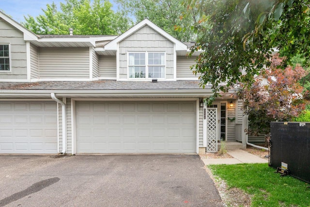 5241 Silver Maple Cir, Minnetonka, MN 55343 - view of property with a garage and asphalt driveway