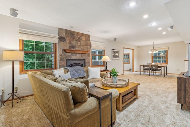 5241 Silver Maple Cir, Minnetonka, MN 55343 - living area with light carpet, a chandelier, a large fireplace, healthy amount of natural light, and recessed lighting