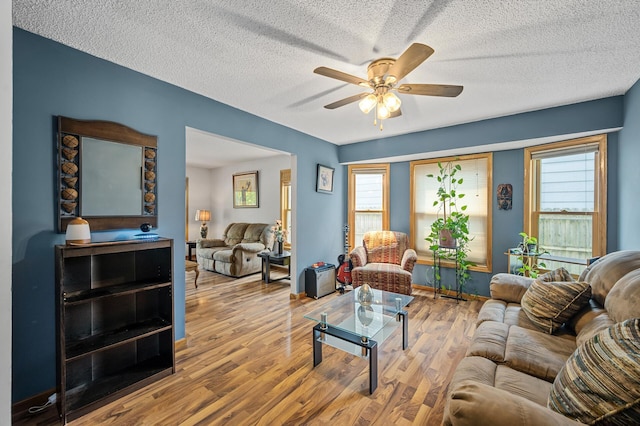 2651 Colfax Ave N, Minneapolis, MN 55411 - living room with a ceiling fan, wood finished floors, plenty of natural light, and a textured ceiling
