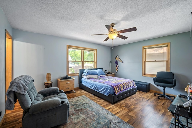 2651 Colfax Ave N, Minneapolis, MN 55411 - bedroom featuring wood finished floors, a textured ceiling, and ceiling fan