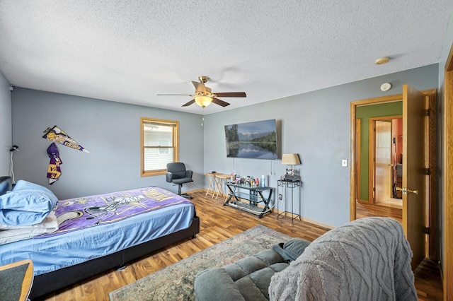 2651 Colfax Ave N, Minneapolis, MN 55411 - bedroom featuring a textured ceiling, wood finished floors, and a ceiling fan