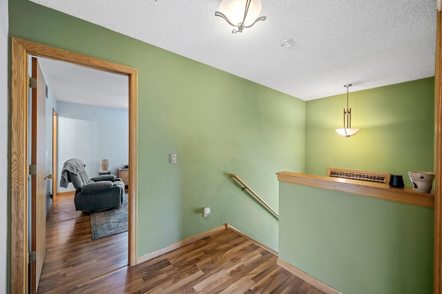 2651 Colfax Ave N, Minneapolis, MN 55411 - hall with an upstairs landing, wood finished floors, and a textured ceiling