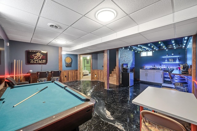 2651 Colfax Ave N, Minneapolis, MN 55411 - game room featuring a dry bar, wine cooler, marble tiled flooring, a wainscoted wall, and wooden walls