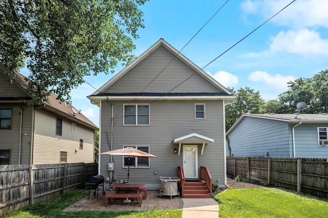 2651 Colfax Ave N, Minneapolis, MN 55411 - back of property with a fenced backyard and a patio