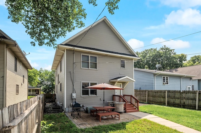 2651 Colfax Ave N, Minneapolis, MN 55411 - back of property featuring a fenced backyard and a patio