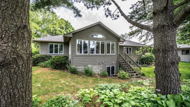 705 Grundhoefer Ct, Northfield, MN 55057 - back of property featuring stairs and a yard