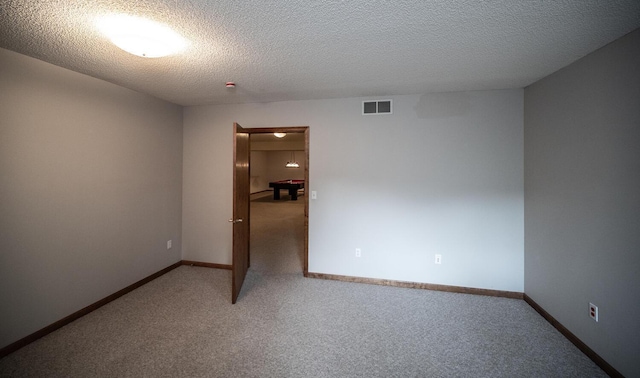 705 Grundhoefer Ct, Northfield, MN 55057 - carpeted spare room with a textured ceiling and baseboards