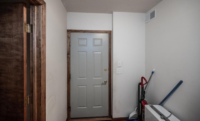 705 Grundhoefer Ct, Northfield, MN 55057 - laundry area featuring a textured ceiling