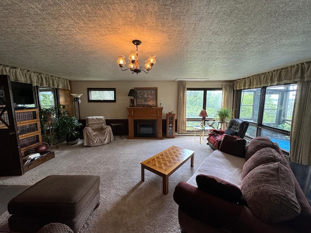22560 Height Of Land Dr, Detroit Lakes, MN 56501 - living area featuring carpet, a chandelier, healthy amount of natural light, a fireplace, and a textured ceiling