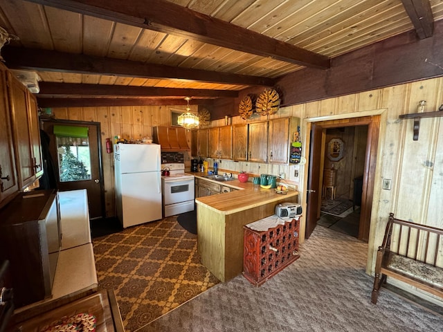 22560 Height Of Land Dr, Detroit Lakes, MN 56501 - kitchen with white appliances, wood walls, a peninsula, light countertops, and brown cabinets