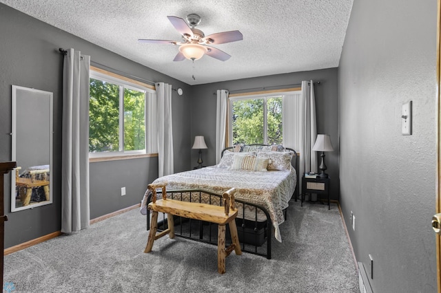 3003 15th Ave S, Moorhead, MN 56560 - carpeted bedroom featuring a textured ceiling, a ceiling fan, and baseboards