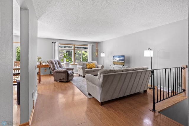 3003 15th Ave S, Moorhead, MN 56560 - living room with wood finished floors and a textured ceiling