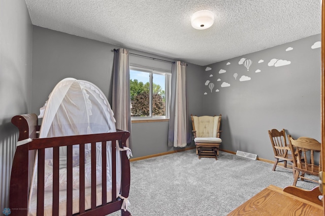 3003 15th Ave S, Moorhead, MN 56560 - carpeted bedroom with a textured ceiling and baseboards