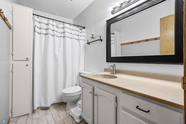 3003 15th Ave S, Moorhead, MN 56560 - bathroom with vanity, a textured ceiling, toilet, and a shower with curtain