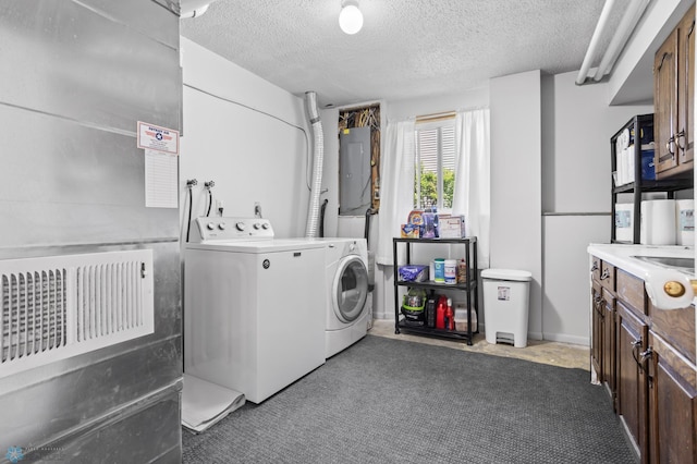3003 15th Ave S, Moorhead, MN 56560 - laundry room featuring independent washer and dryer, electric panel, a textured ceiling, and carpet