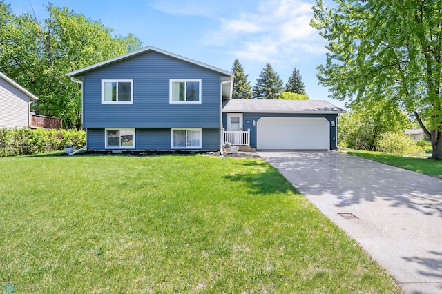 3003 15th Ave S, Moorhead, MN 56560 - split level home featuring an attached garage, driveway, and a front yard