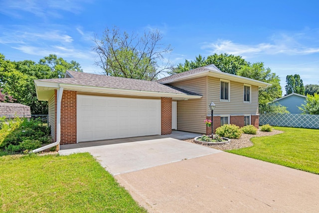 2613 107th Ln NW, Coon Rapids, MN 55433 - split level home featuring concrete driveway, brick siding, a garage, and a shingled roof