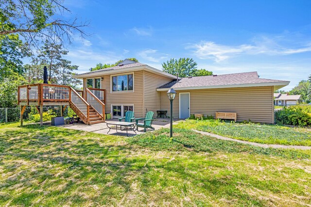 2613 107th Ln NW, Coon Rapids, MN 55433 - rear view of property with a wooden deck, a patio, and stairway