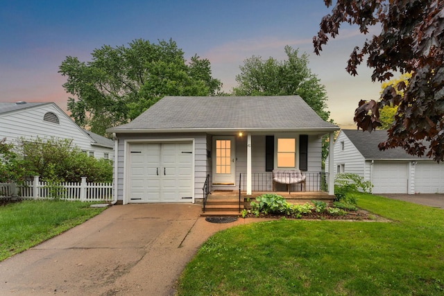 41 17th Ave N, Hopkins, MN 55343 - view of front of home featuring a porch, driveway, and a garage