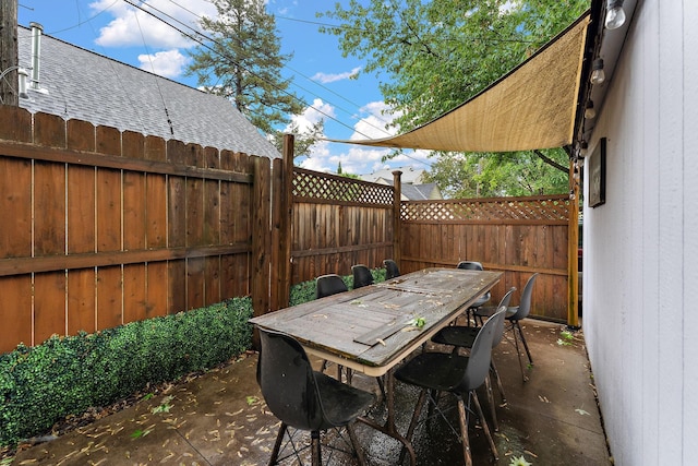 41 17th Ave N, Hopkins, MN 55343 - fenced backyard with outdoor dining area and a patio