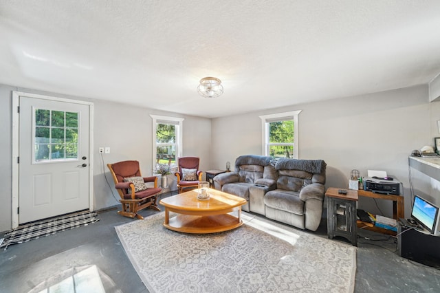 S233 Church Ave, Spring Valley, WI 54767 - living room featuring unfinished concrete floors and a textured ceiling
