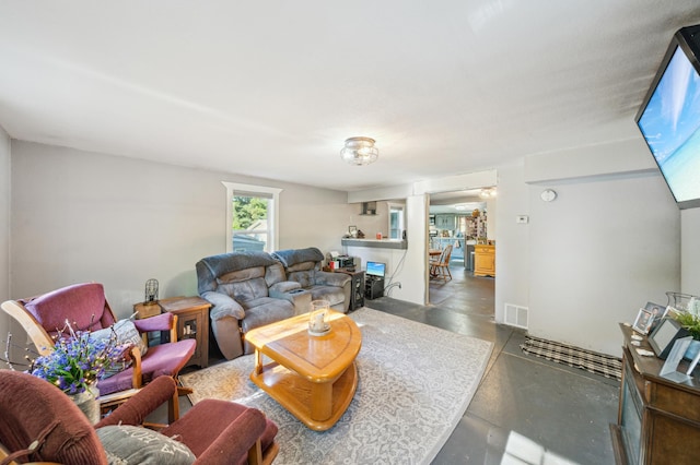 S233 Church Ave, Spring Valley, WI 54767 - living area featuring concrete floors and decorative columns