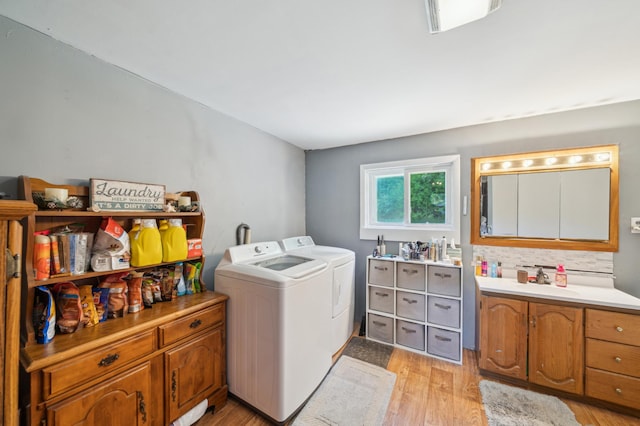 S233 Church Ave, Spring Valley, WI 54767 - washroom with washing machine and clothes dryer and light wood-style floors