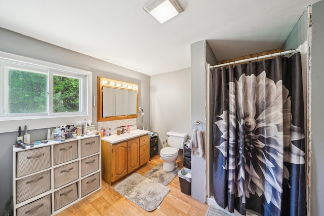 S233 Church Ave, Spring Valley, WI 54767 - full bath with wood finished floors, vanity, toilet, and a shower with shower curtain