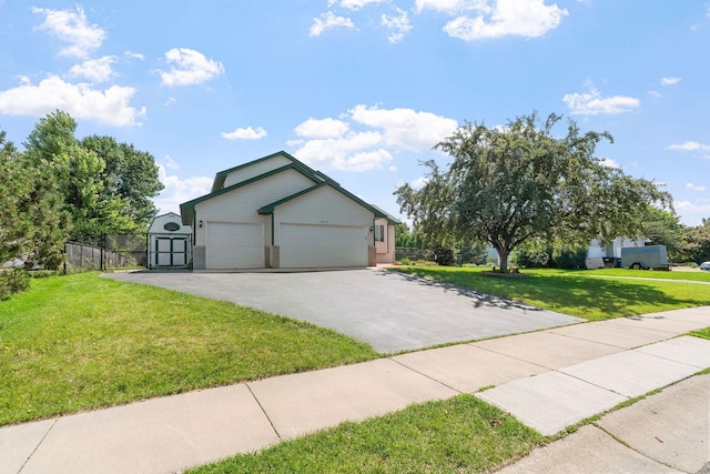 10779 57th St NE, Albertville, MN 55301 - view of front of home featuring driveway, a storage unit, and a garage