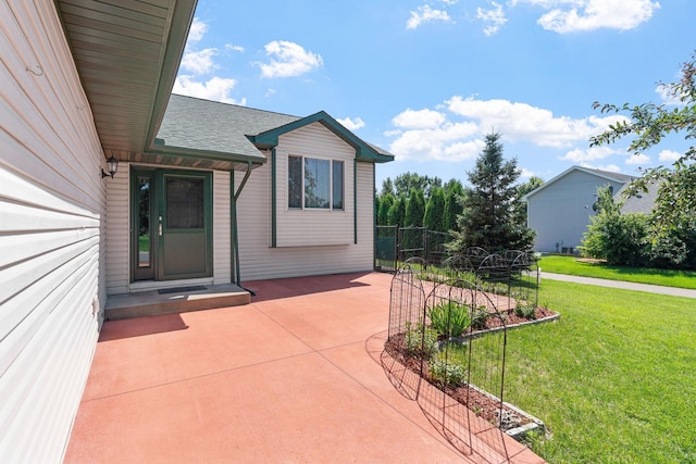 10779 57th St NE, Albertville, MN 55301 - entrance to property featuring a yard, roof with shingles, and a patio