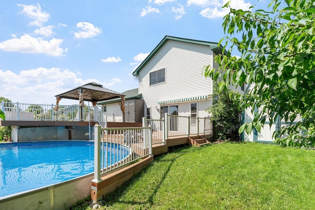 10779 57th St NE, Albertville, MN 55301 - swimming pool featuring a deck, a gazebo, and a lawn