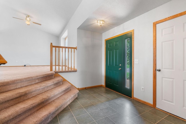 10779 57th St NE, Albertville, MN 55301 - entryway featuring dark tile patterned flooring, ceiling fan, and stairs