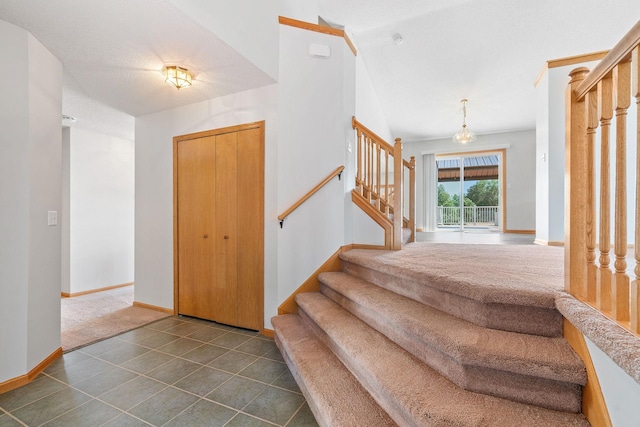 10779 57th St NE, Albertville, MN 55301 - foyer entrance with stairway and dark tile patterned flooring