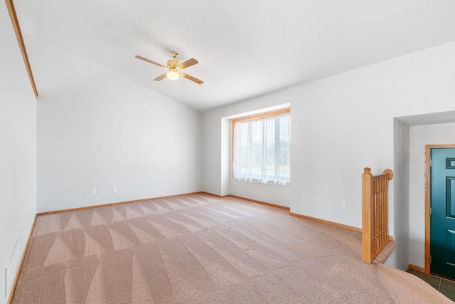 10779 57th St NE, Albertville, MN 55301 - empty room featuring light colored carpet, vaulted ceiling, and a ceiling fan
