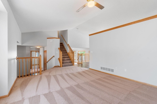 10779 57th St NE, Albertville, MN 55301 - unfurnished living room with ceiling fan, carpet flooring, and lofted ceiling