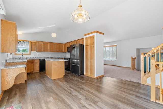 10779 57th St NE, Albertville, MN 55301 - kitchen with black appliances, a chandelier, lofted ceiling, wood finished floors, and a kitchen island