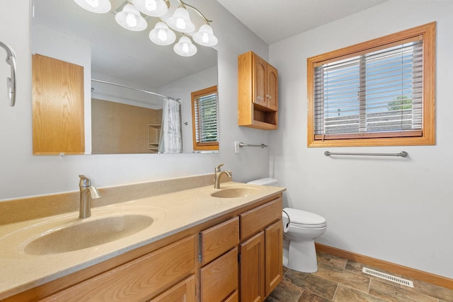 10779 57th St NE, Albertville, MN 55301 - full bath featuring double vanity, stone finish floors, and a shower with curtain
