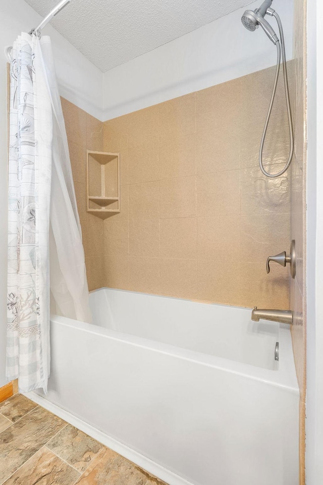 10779 57th St NE, Albertville, MN 55301 - bathroom with shower / tub combo with curtain and a textured ceiling