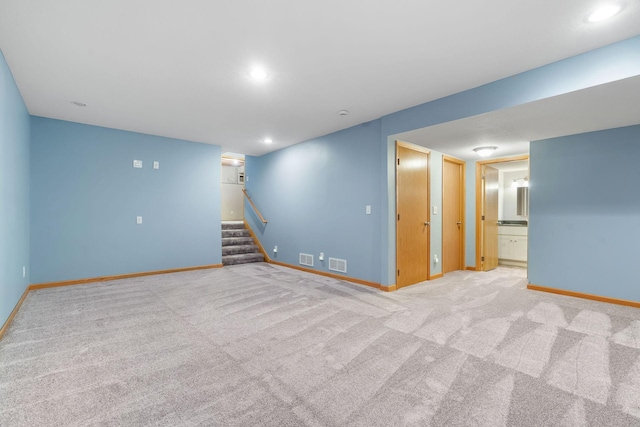 10779 57th St NE, Albertville, MN 55301 - finished basement featuring stairway, carpet, and recessed lighting