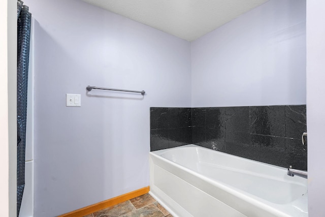 10779 57th St NE, Albertville, MN 55301 - full bath featuring a bath and stone finish flooring