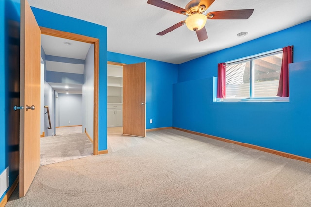10779 57th St NE, Albertville, MN 55301 - unfurnished bedroom featuring carpet floors and a ceiling fan