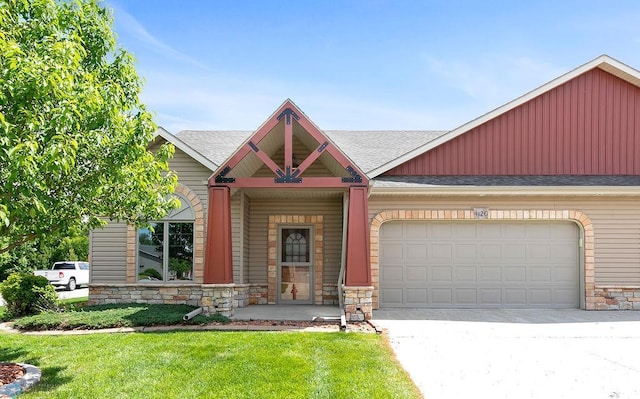 412 19th Ave W Unit G, West Fargo, ND 58078 - craftsman house with a shingled roof, an attached garage, stone siding, and concrete driveway
