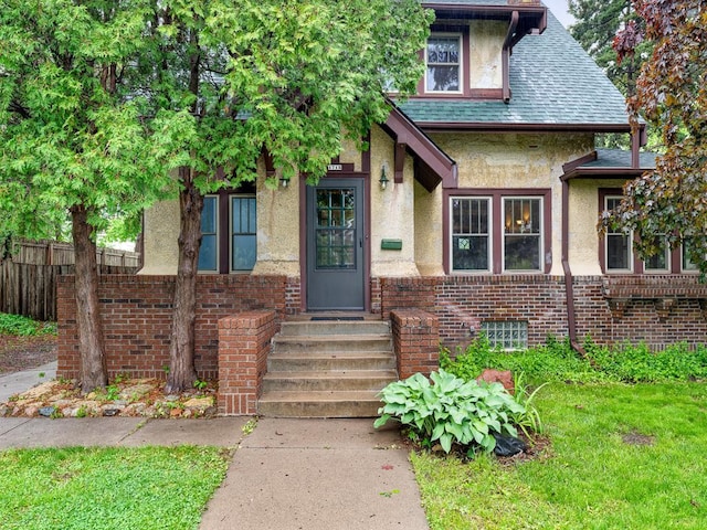 1715 Bush Ave, Saint Paul, MN 55106 - view of front of property featuring stucco siding and entry steps