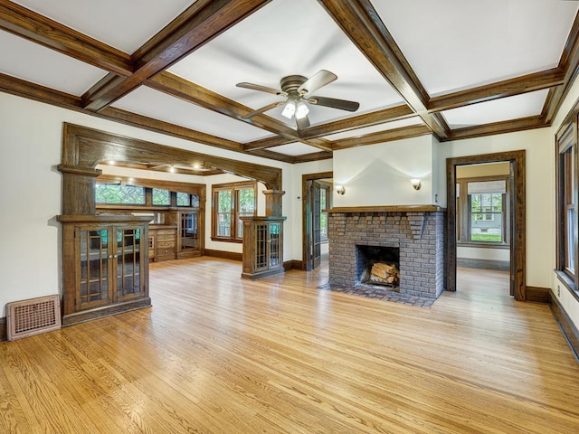 1715 Bush Ave, Saint Paul, MN 55106 - unfurnished living room featuring light wood finished floors, baseboards, a fireplace, coffered ceiling, and ceiling fan