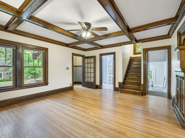1715 Bush Ave, Saint Paul, MN 55106 - unfurnished living room with coffered ceiling, light wood finished floors, a ceiling fan, baseboards, and stairway