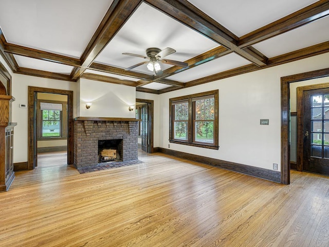 1715 Bush Ave, Saint Paul, MN 55106 - unfurnished living room with a brick fireplace, light wood-style flooring, baseboards, coffered ceiling, and ceiling fan