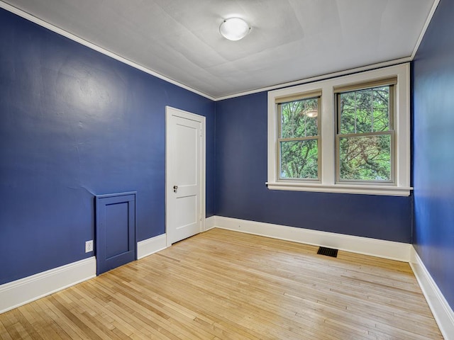 1715 Bush Ave, Saint Paul, MN 55106 - spare room with hardwood / wood-style flooring and baseboards
