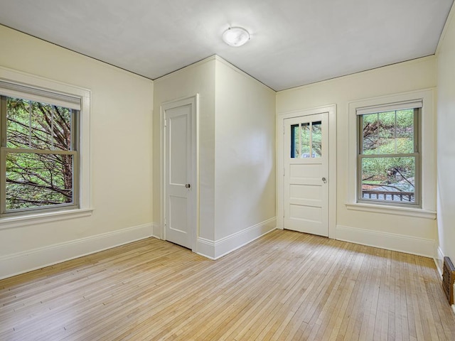 1715 Bush Ave, Saint Paul, MN 55106 - foyer featuring plenty of natural light, light wood-style floors, and baseboards