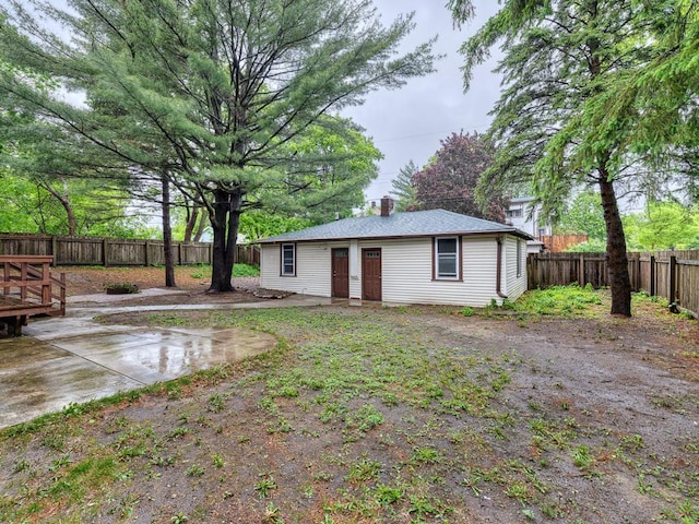 1715 Bush Ave, Saint Paul, MN 55106 - back of house featuring a fenced backyard and a chimney